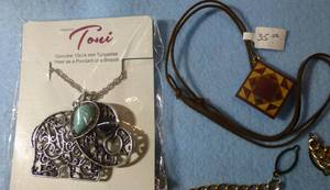Vintage unique pieces including a wooden quilt and a turquoise elephant