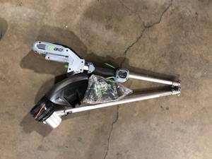 lot 17 image: EGO Power ST1502SA 15-Inch 56-Volt Cordless String Trimmer with Rapid Reload and Split Shaft 2.5Ah Battery and Charger Included, Black  Customer Returns See Pictures