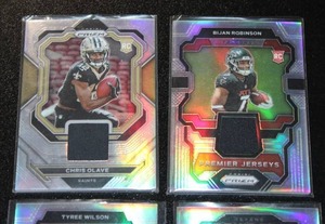 lot 73 image: 2022 & 2023 Prizm Rookie Jersey Relic Lot  4 Cards  Anderson - Robinson - Olave - Wilson