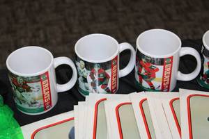 lot 99 image: Mixed Novelty Collectibles Lot  Vault Blow Ups - Kirby Puckett Folders - Minnesota Wild Mugs