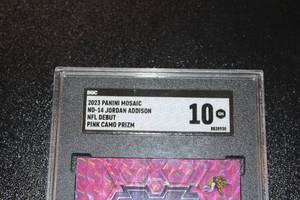 lot 233 image: 2023 Mosaic Pink Camo Prizm Jordan Addison #ND-14 Rookie Card SGC 10
