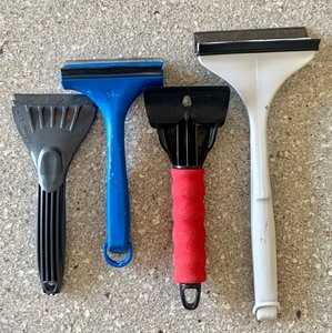 Variety of Ice Scrappers including an Eddie Bauer Heated Windshield Ice Scraper 12 Volt Car Plug In