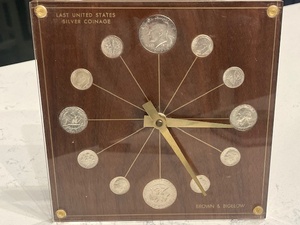 lot 100 image: Clock with Silver Coins from 1964