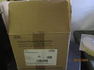 lot 82 image: case of dupont xl coveralls...