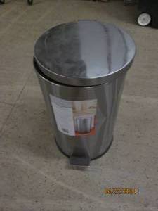 lot 103 image: garbage can has dent...