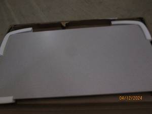 lot 128 image: 24x48 inch table with folding legs...
