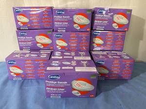 lot 37 image: MSRP $400  13 Boxes (20 each per box) CareBag Bedpan Liners - a leak-resistant medical grade bag equipped with a unique super absorbent pad which turns up to 16oz of body fluids into a gel in a matter of seconds.