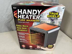 New Handy Heater Pure Warmth Ceramic Space Heater with LED Lights
