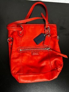 lot 77 image: Orange coach purse