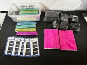 lot 128 image: Toothbrush Travel Containers, Nail Buffers, Bobby pins, Hair ties,