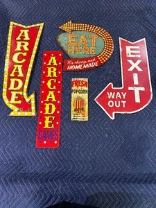 lot 174 image: Five vintage arcade, eat here, exit signs