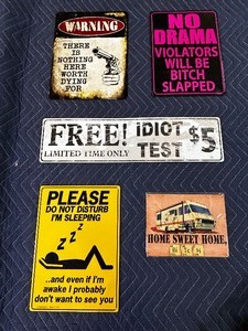 lot 180 image: Five vintage metal humor related signs