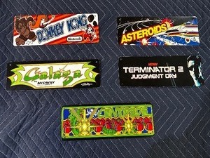 lot 182 image: Five vintage arcade game metal signs