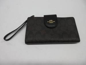 lot 806 image: COACH Tech Phone Wallet In Colorblock Signature Canvas SLIGHTLY USED, MISSING SNAP BUTTON