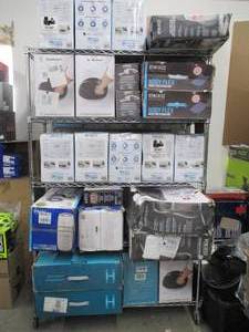 lot 715 image: Rack full of Homedics, Vaporizers, Massagers, Purifiers and More - These items all have some issues or make noise - For PartsRestore.  No Reserve - Rack is not included