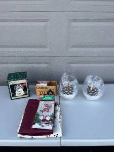 lot 19 image: Christmas Decor  Tablecloths  Pfaltzgraff Snow Globe  and Decor