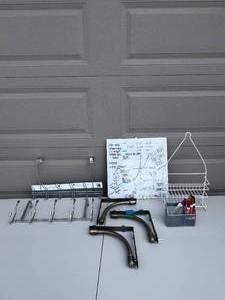 lot 31 image: Two Over the Door Hooks  Shower Caddie  Dry Erase Board  Magnetic Pen Organizer  3 L Brackets