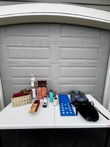 lot 32 image: 3 Decorative Wood Boxes  300 Piece Santa Puzzle  21oz Hydro Flask  Collapsable Basket  History of Cannabis Medical Poster  Polo Wristwatch  Neck Pillow