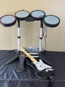 lot 129 image: PlayStation Rock Band Drum Kit, Guitar and Microphone