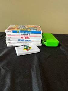 lot 130 image: Wii Dance Dance Revolution Games and Nintendo DS Case