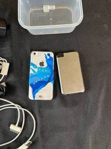 lot 151 image: Apple Cell Phones and Chargers