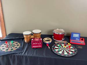 lot 180 image: Childrens Instruments and Toys - Bongos, Drum, Tambourine, etc. Dart Board and Talking Whiz-Kid Plus