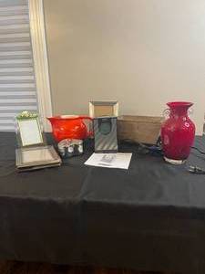 lot 190 image: Colorful Home Decor - Timex Projection Alarm Clock Radio, Tall Red Glass Vase, Red Pitcher Vase, Picture Frames, etc
