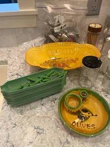 lot 214 image: Kitchenware and Baking Cookie Cutters, Corn Holders, Pampered Chef Measuring Cup, Beautiful Buscuit Bowl w very minor chip, Olive Serving Tray, and More