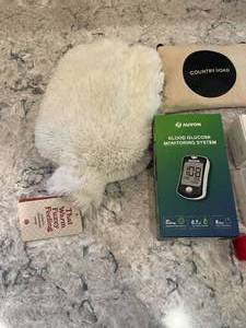 lot 223 image: Hot Water Bottle Heating Pad, Thermometer, Pill Organizers, Blood Pressure Monitor, Glucose Monitor and Sleep Mask
