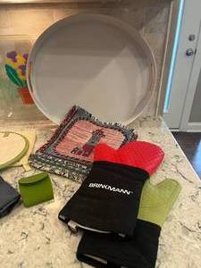 lot 221 image: 3 Plastic Serving Trays (Floral and Coral), Oven Mits, Hot Pads, Hot Handle Sleeve, Funnels, Matches, etc