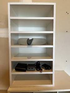 lot 310 image: 2 Shoe Storage Units and One 6 Shelf Unit inc. Shoes and Cleats, Misc Electronic Accessories, Ball Pumps, Umbrellas and More