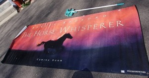 lot 100 image: Huge Canvas-Style Theatre Advertising Poster wGrommets The Horse Whisperer Coming Soon Touchstone Pictures...