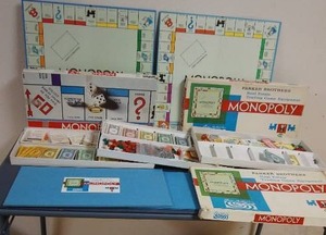 lot 146 image: Multiple Monopoly Sets w Bag of Vintage Play Pieces
