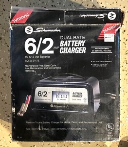 lot 228 image: Extension Cords and Schumacher Battery Charger