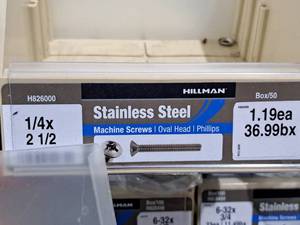 lot 412 image: Lot of (70) Hillman Stainless Steel Machine Screws 14x2-12  Oval Head  Phillips Drive #H826000
