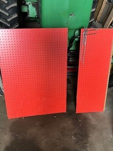 peg board with a few hooks