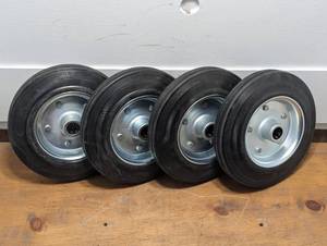lot 55 image: Set of 4 - 8 20050-100 Heavy Duty Wheels - 34 shaft