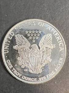 lot 60 image: 1 TROY OZ .999 FINE SILVER AMERICAN EAGLE DESIGNED ROUND