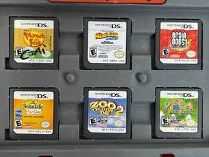 lot 105 image: Nintendo DS Game Lot and Super Mario Hard Carrying Case