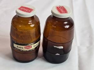 lot 69 image: Schmidt Bottle Salt and Pepper Shakers