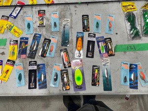 TABLE FULL OF FISHING SPOONS