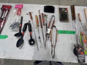 TABLE FULL OF GRILLING ACCESSORIES