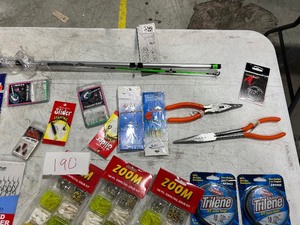 TABLE FULL FISHING LINE, LURES, PLASTICS, TACKLE BOX, & ROD N REEL