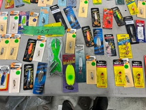 TABLE FULL OF SPOONS, SPINNERS, & LINE