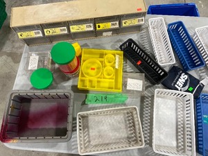 TABLE FULL OF STORAGE CONTAINERS