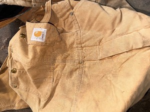 lot 215 image: Bin of Fishing Gear and Rain Gear Including a Pair of Vintage Insulated Carhartt Bibs