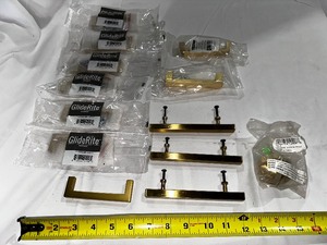 lot 247 image: Variety of High End Brushed Gold Cabinet Pulls as Seen in Photo