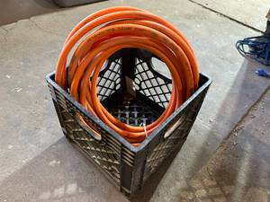lot 245 image: Bin with Roll of Garden Hose