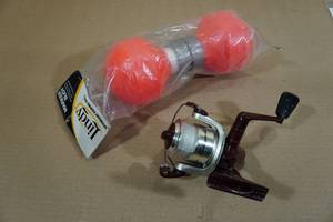 lot 95 image: Shakespeare Spinning Reel with Lindy Marker Buoy