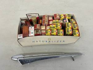 lot 162 image: Hood Ornament & Spark Plugs